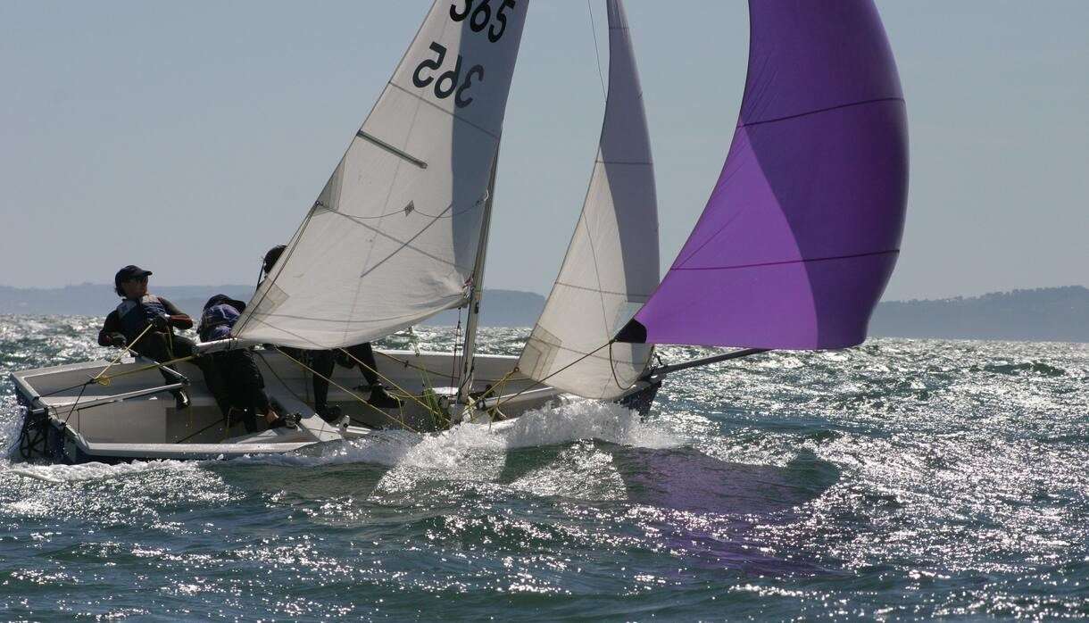 Sailboat with people on the water