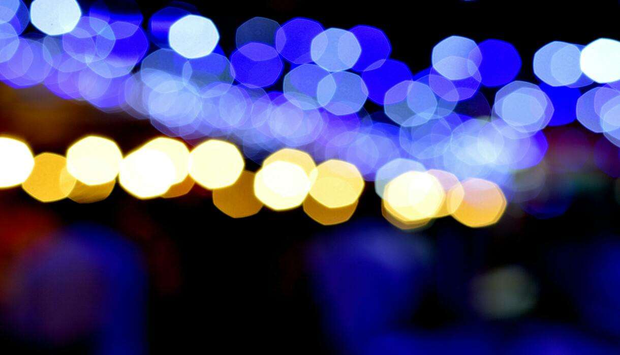Abstract bokeh photo capturing blue and orange lights
