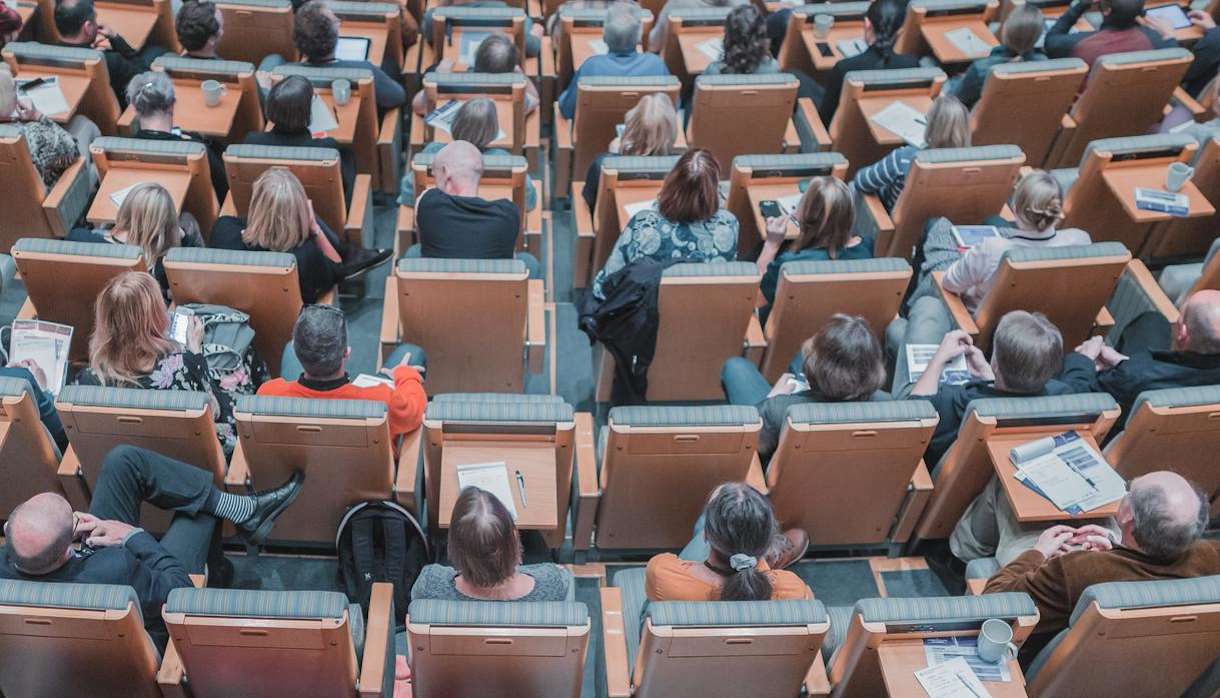 Individuals in busy conference