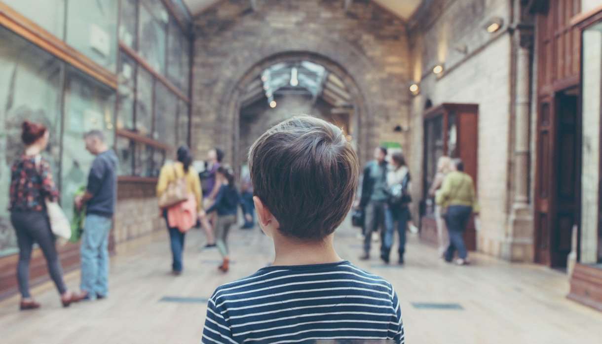 Child looking around a museum