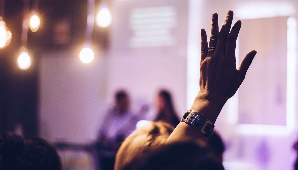 Hand raised to ask a question