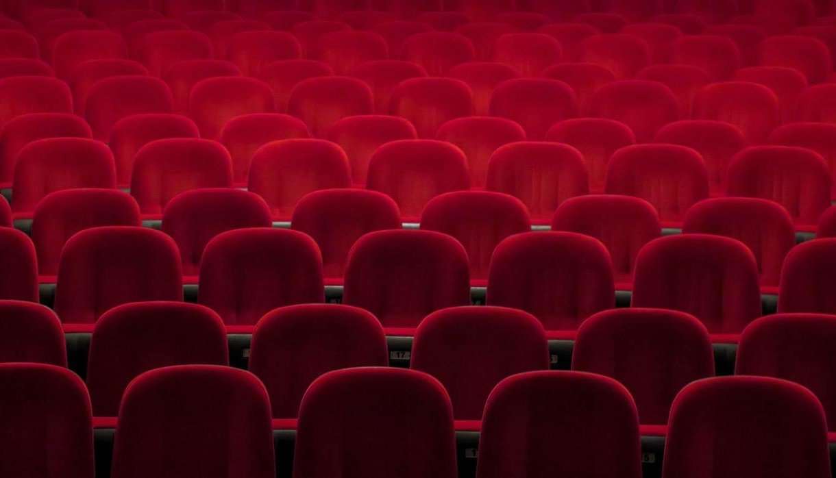 Empty red seats in a theatre