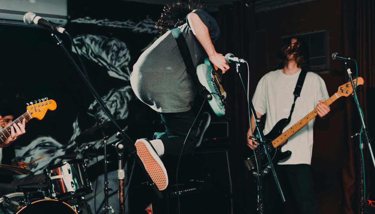 Guitarist jumping on stage