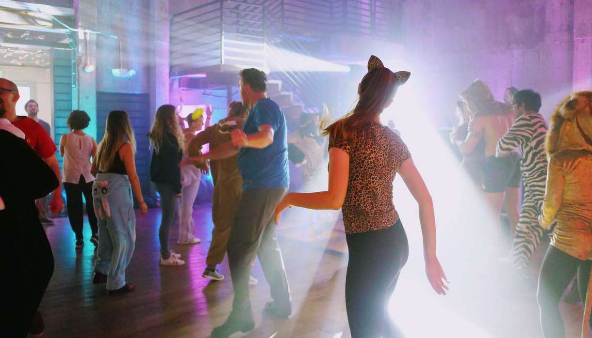 Costume dance party with bright lights