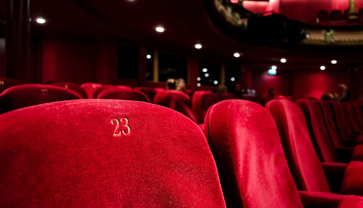 Red numbered seats at a theatre