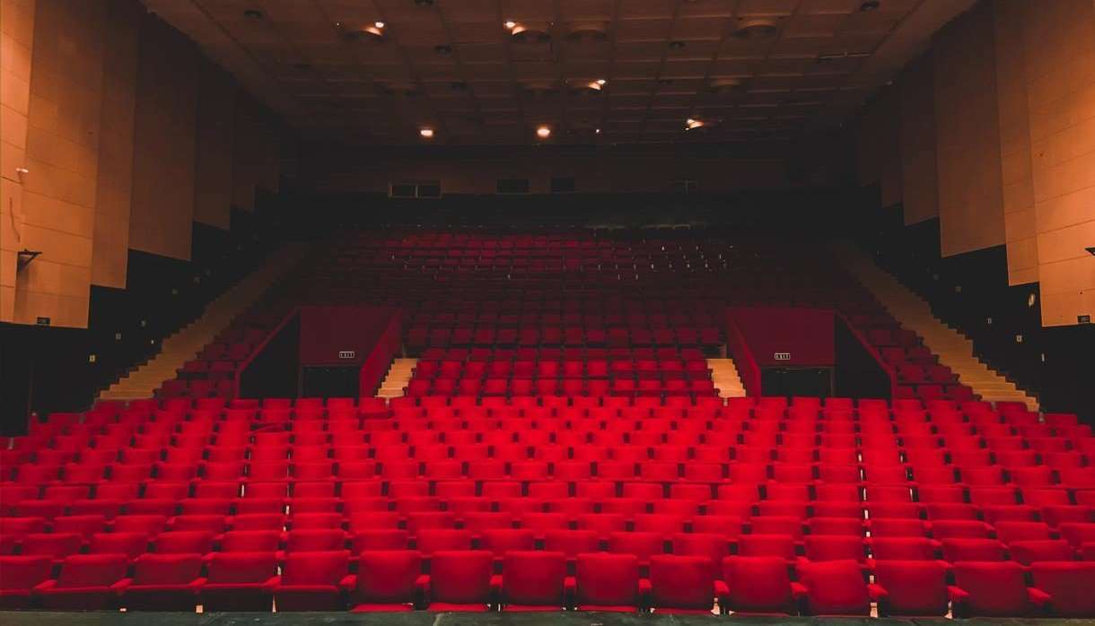 Empty red seats in a theatre