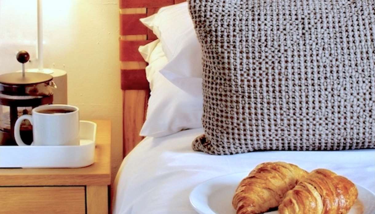 Bedside table - coffee and croissants