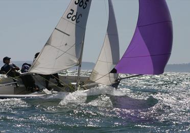 Sailboat with people on the water