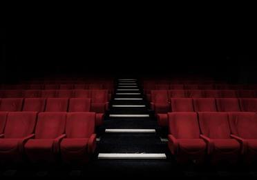 Empty red seats in a theatre