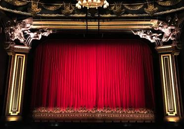 Red curtain at a performance theatre