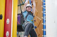 Reach up at Clip 'n Climb Exeter