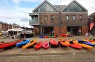 Kayaks & canoes outside the store