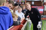 Fans meeting players pitchside