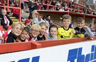Young fans on match day at Exeter City Football Club