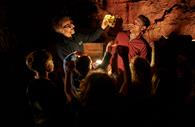 Prehistoric Humans being shown in Kents Cavern Caves