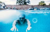 Person underwater in the pool