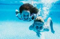 Children underwater in the pool
