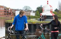 Cycling by the Quay. Copyright: Tony Cobley