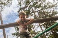 A child playing around at Haldon Forest Park