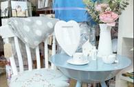 Table set up with flowers, gifts and tea cup and saucer
