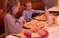 Kids love a pizza and milkshake combo.