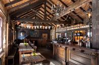 Wooden beans and tables inside The Old Fire House
