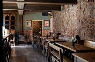Stone walls and wood design inside The Old Fire House.