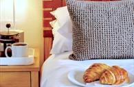 Bedside table - coffee and croissants