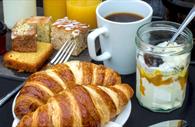 Continental breakfast - croissants, yoghurt, coffee and cake