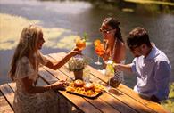 Cocktails and burgers enjoyed beside the water.