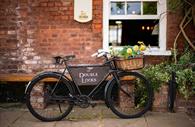 Vintage bike with flowers welcomes visitors to Double Locks.