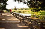 Picnic tables beside the water at Double Locks.