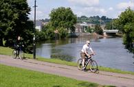 People cycling along Exeter Canal