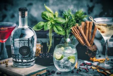 Exeter Gin presented in a glass with ice and a lime