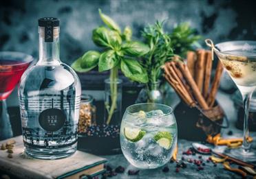 Exeter Gin presented in a glass with ice and a lime
