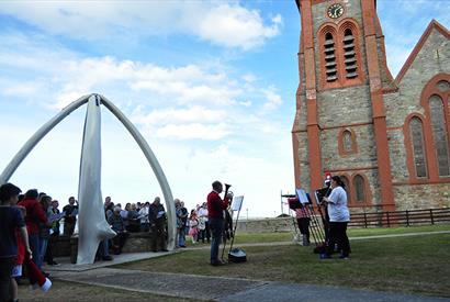 Christmas Carols under the Whalebone Arch