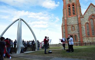Christmas Carols under the Whalebone Arch