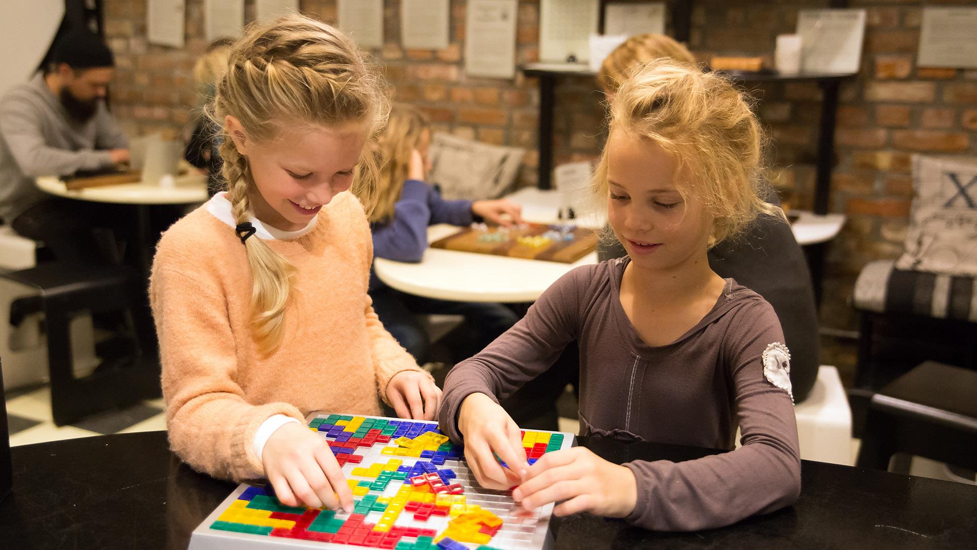 Happy girls playing a logical game at Vitensenteret Innlandet