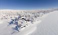 Dronebilde av snødekket Rustad hotel & Fjellstue