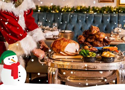 Santa serves a festive themed roast dinner at the Borrowdale Hotel in the Lake District, Cumbria