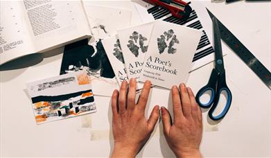Hands holding copies of a booklet titled 'A Poet’s Scorebook: Composing With Wordsworth in Nature,'