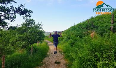 Visitor on a Walking Holiday with Coast to Coast Packhorse in the Lake District, Cumbria