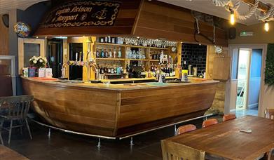 Nautical themed bar shaped like a ship's stern at Captain Nelson Tavern in Maryport, Cumbria