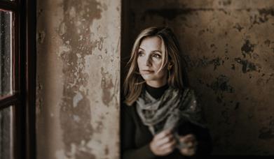 Cara Dillon looking out of a window