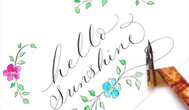 Swirly Calligraphy which says "Hello Sunshine"
