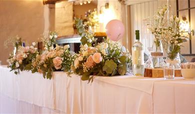 Head Table Decorations for a Wedding at Crooklands Hotel in Milnthorpe, Cumbria