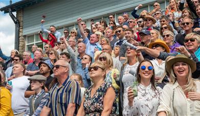 Crowd Cheering at the Cartmel Racecourse 2024 Race days at Cartmel Racecourse in Cartmel, Cumbria