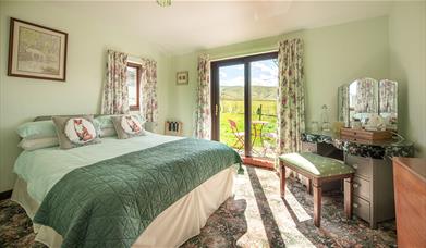 Double Bedroom with Dressing Table and Outdoor Access at High Greenside Bed and Breakfast in Ravenstonedale, Cumbria