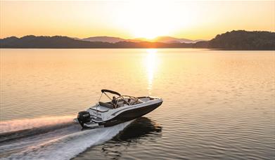 Boat on a Lake at Sunset, from Freedom Boat Club Windermere in Bowness-on-Windermere, Lake District