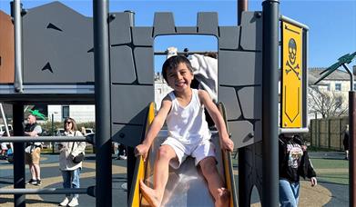 Child on the Shiver Me Timbers playground at Lake District Coast Aquarium in Maryport, Cumbria